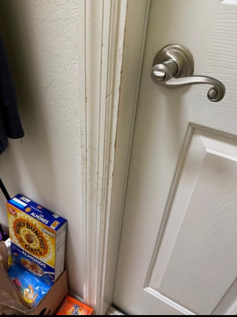 Door and trim area before detailed home cleaning