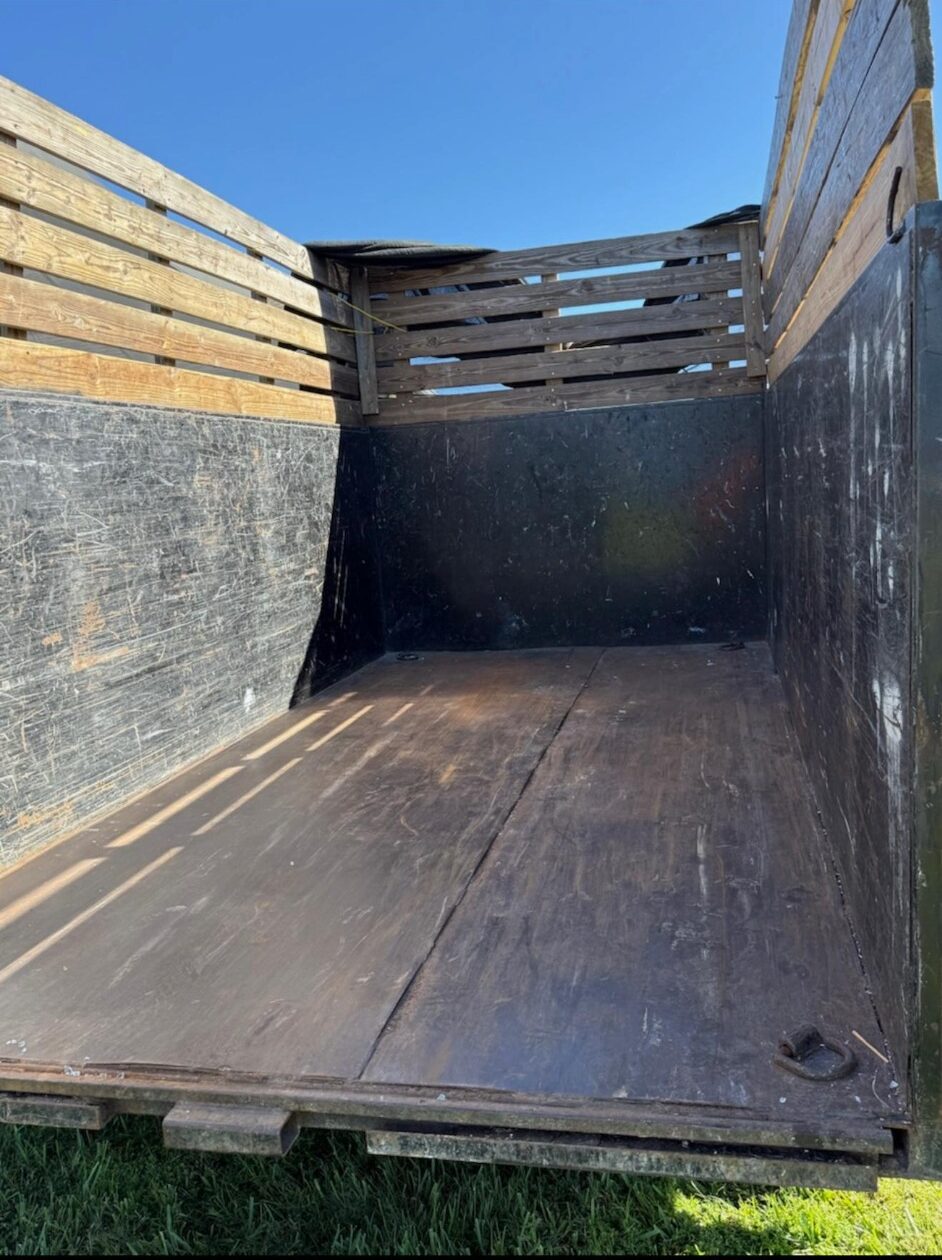 Empty dump trailer ready for dumpster rental