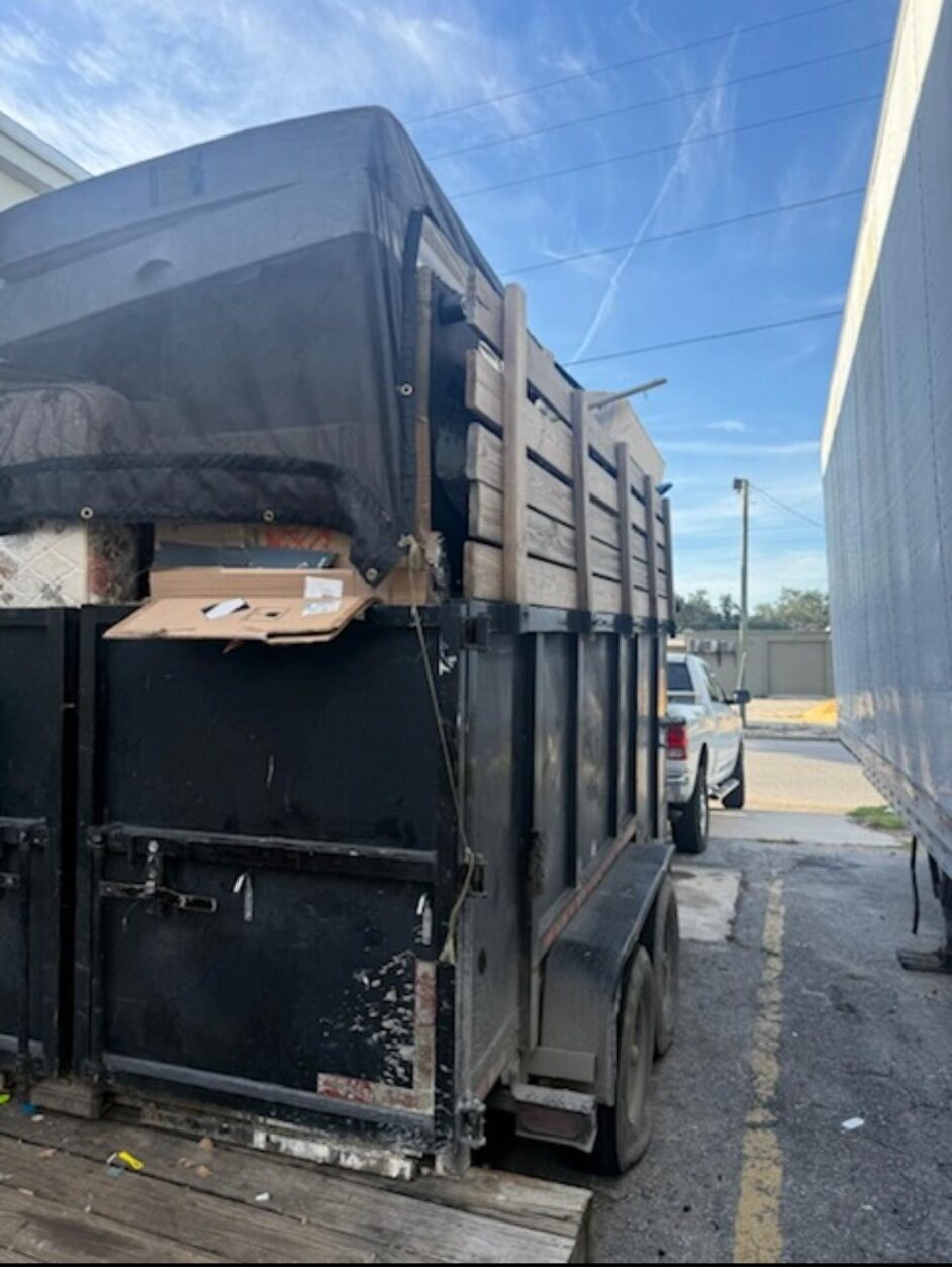 Dump trailer loaded during a cleanup project
